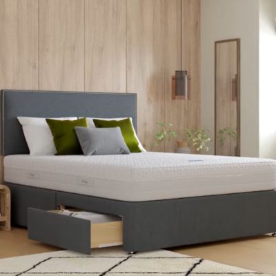 A cheap divan bed base in gray color including mattress and headboard